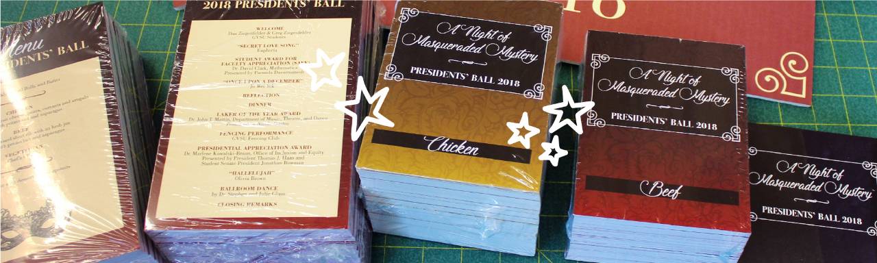 Stacks of menus and meal cards for Presidents' Ball